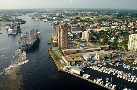 aerial photography of high rise buildings near body of water thumbnail