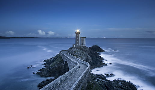gray lighthouse near body of water thumbnail