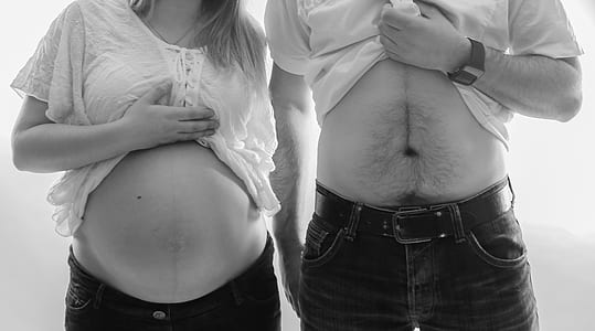 man and woman in white tops thumbnail