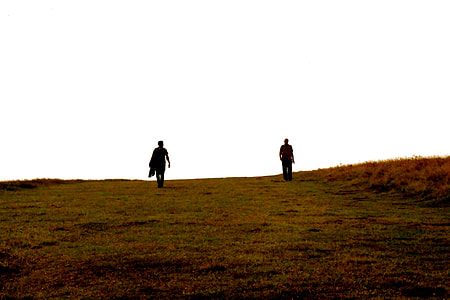 person on grass field during day thumbnail