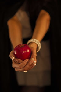 person holding red apple thumbnail
