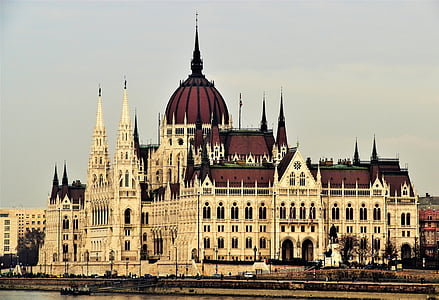white and brown painted cathedral near bridge thumbnail
