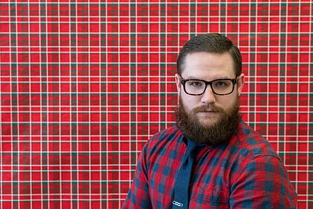 man wearing red and blue gingham button-up shirt and black necktie thumbnail