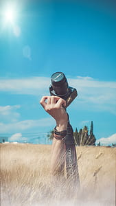 Person Holding Black Canon Dslr Camera Kit thumbnail