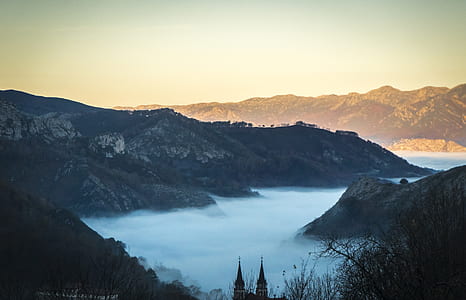 grey mountains under grey sky thumbnail