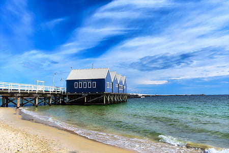 blue house at the beach during daytime thumbnail