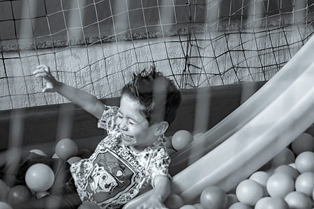 grayscale photography of playing boy thumbnail