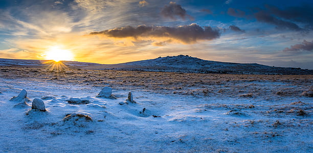 snow covered mountain during golden hour thumbnail