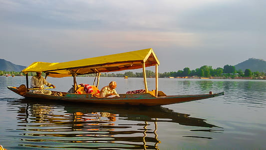 yellow boat in body of water thumbnail