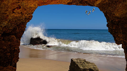 rock formation near sea waves thumbnail
