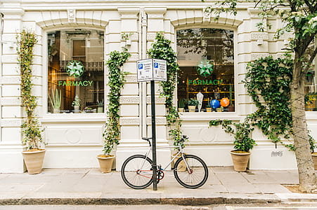 Black and White Bicycle Beside Post thumbnail
