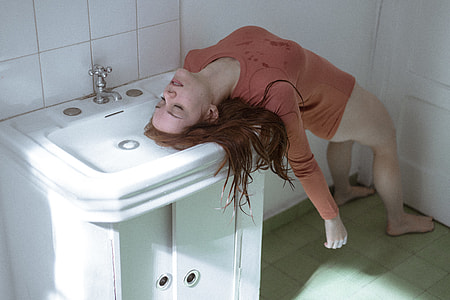 photo of bottomless woman wearing brown top in unconscious condition thumbnail