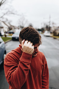 man wearing orange sweater thumbnail