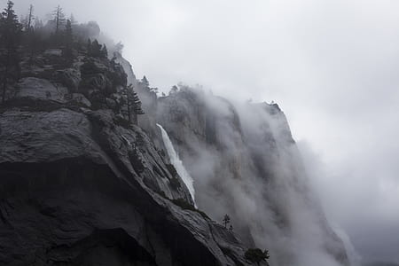 waterfalls coming from foggy mountain thumbnail