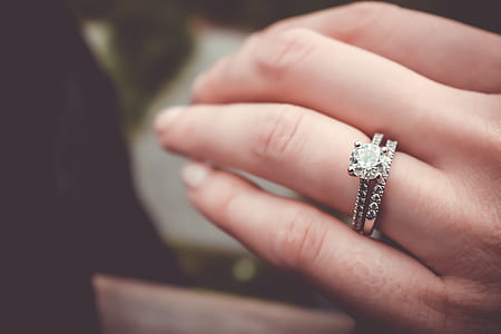 silver-colored ring with gemstone in macro shot photography thumbnail