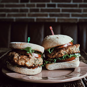two burger sandwiches served on plate thumbnail