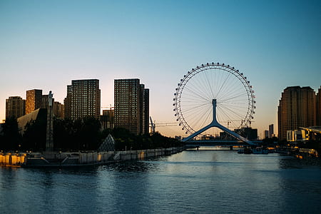 ferris wheel beside body of water thumbnail