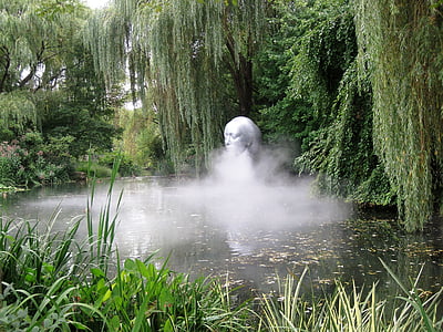 water fountain statue surrounded by trees thumbnail