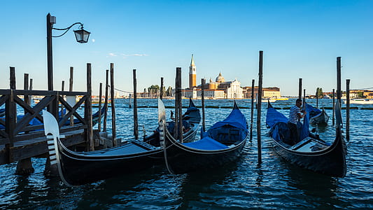 three blue gondolas near brown deck thumbnail