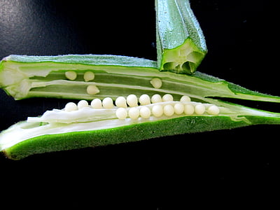 sliced okras on black surface thumbnail