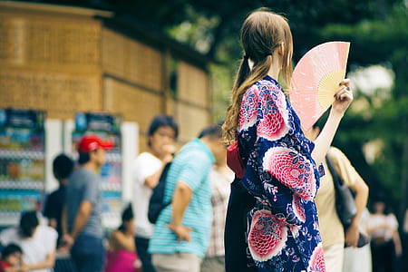woman in blue kimono holding fan thumbnail