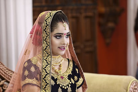Woman Wearing Black and Gold Sari thumbnail