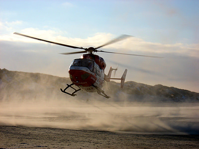 white and red flying helicopter thumbnail