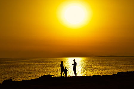 silhouette photo of peoples thumbnail