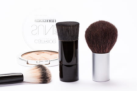 Black Make Up Brush Near Silver Make Up Palette thumbnail