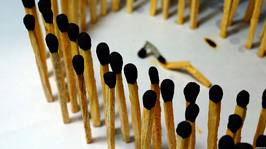 match sticks standing on white surface thumbnail