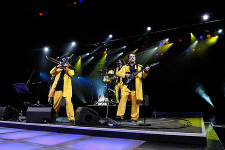 band performing on stage near speakers thumbnail