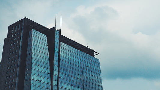 low angle photography of glass building thumbnail