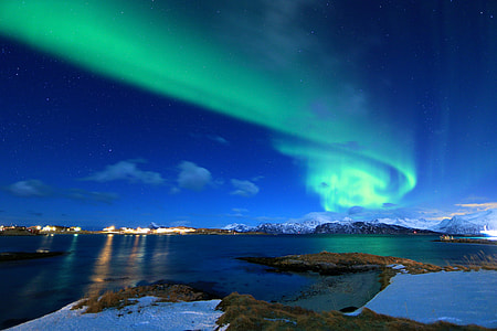 northern lights over the sky during twilight thumbnail
