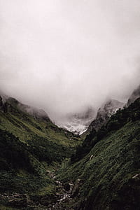 landscape photography of mountain with fogs at daytime thumbnail