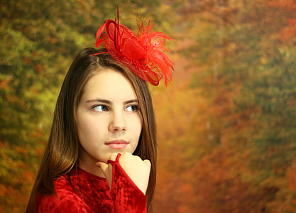 focus photo of woman in red long-sleeved top thumbnail