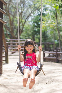 toddler riding on swing thumbnail
