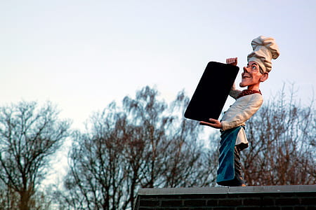 male chef holding board standee thumbnail