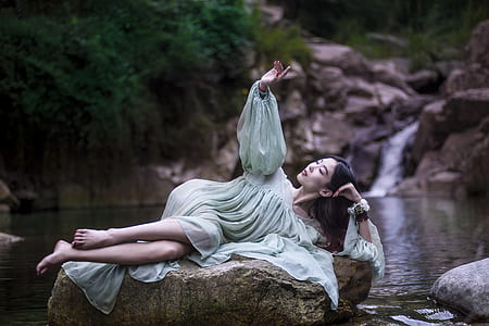 woman laying down on rock thumbnail