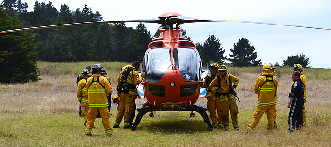 group of firemen near helicopter at daytime thumbnail