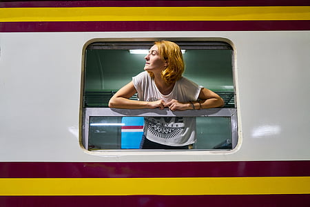 woman leaning on train window thumbnail