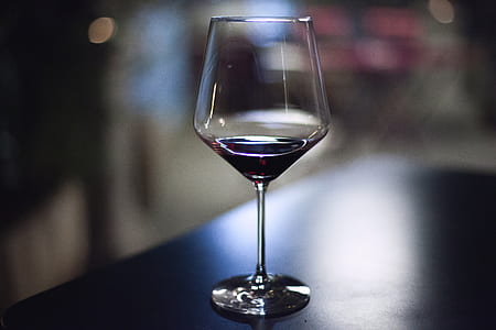 clear long-stem wine glass on top of the table thumbnail