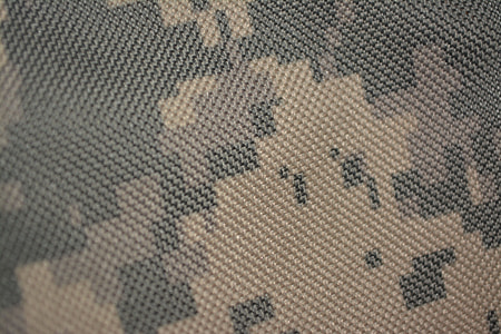 close up photo of gray and brown camouflage knitted textile thumbnail