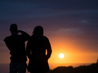 silhouette of man and woman during sunset thumbnail