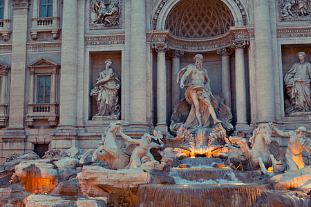 An early evening shot of the architectural details of the world-famous Trevi Fountain statue in Rome, Italy thumbnail