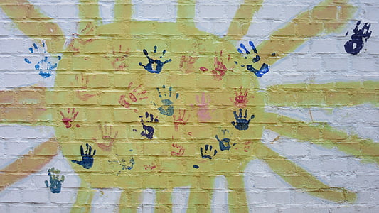assorted-color of hand prints printed on wall thumbnail