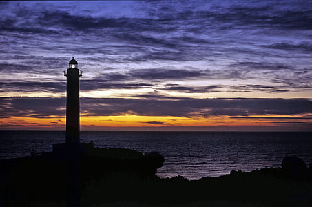 silhouette of lighthouse during sunset thumbnail