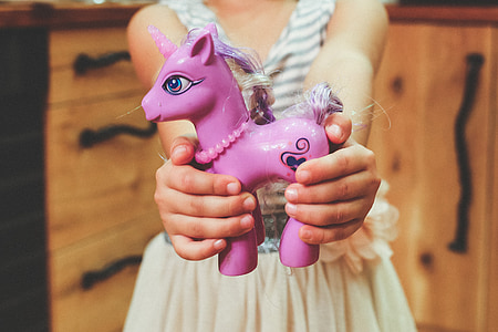 girl carrying people unicorn toy thumbnail