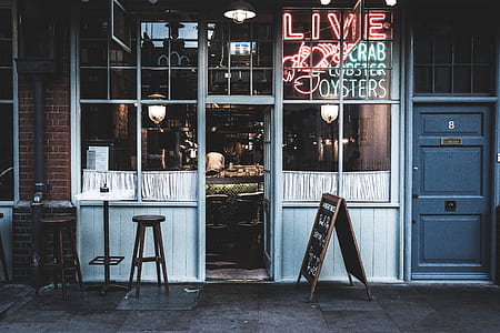signage and bar stools in front of shop thumbnail