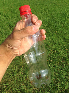 person holding plastic bottle thumbnail