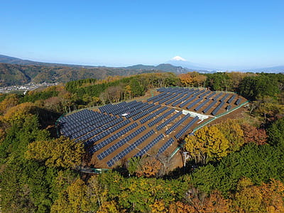 aerial view of brown and green field under blue sky during daytime thumbnail